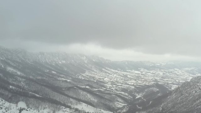 Winter scenery with snowed valley in Eastern Serbia 4K drone video