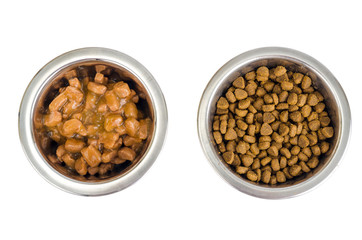 Metal bowls with various pet food.