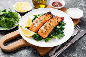 Salmon fillet with spinach .