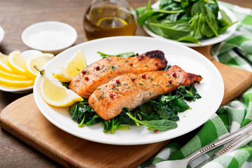 Salmon fillet with spinach .