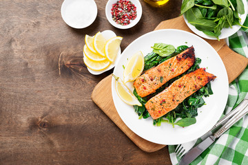Salmon fillet with spinach .