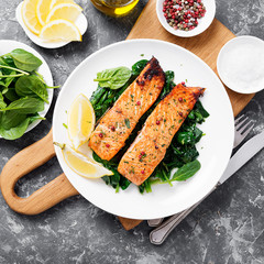 Salmon fillet with spinach .
