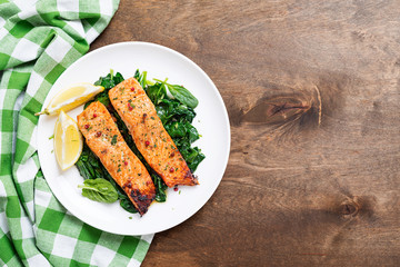 Salmon fillet with spinach .