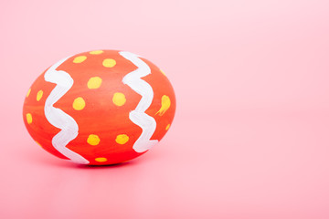 Beautiful Easter Red egg color on pink background, Easter day concept