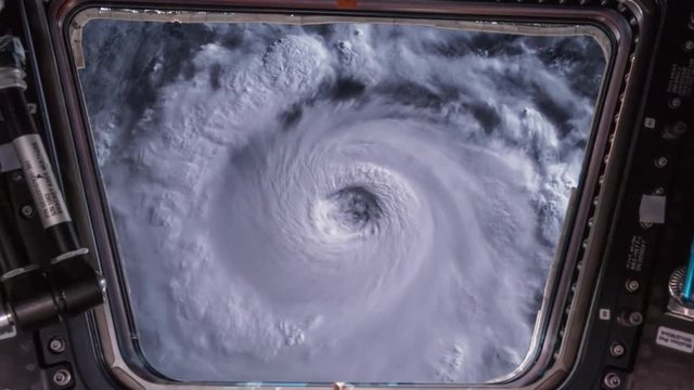 Hurricane Storm tornado as seen through window of International Space Station ISS , satellite view. Elements of this image furnished by NASA