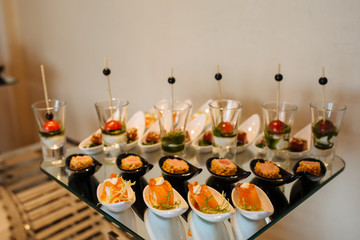 Variety assortment of different luxury food snacks and appetizers, concept of decorated catering banquet set, on a party event celebration