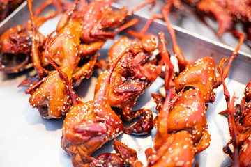 Grilled quail Placed in the tray for sale in the local market, Thailand.