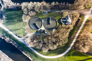 A dutch water treatment plant for cleaning the sewage water, seen from above during sunset. Near Waalwijk, Noord-Brabant, Netherlands.