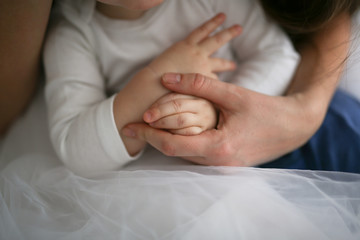 hands of baby and hands of mother, motherhood