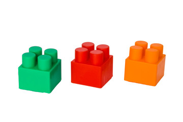 Obraz premium details of a children's plastic constructor on a white background. colored cubes. block.