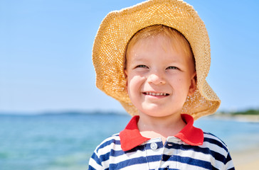 Toddler boy on beach