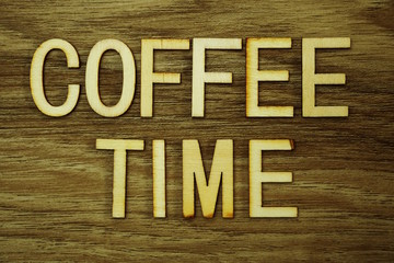 Coffee Time text message on wooden background