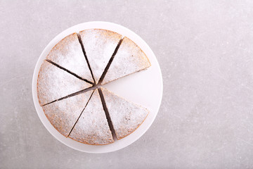 Sliced cake on plate with slices