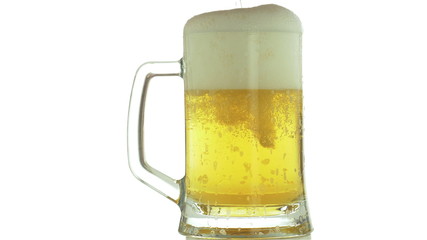 Oktoberfest. Beer mug on a which foam flows down