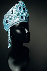 Head of mannequin in creative blue Russian kokoshnick with jewels and pearls