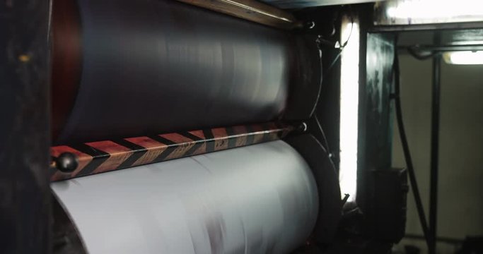 Printing machine. Large paper roll print machine in production