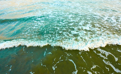 Sandy beach and soft sea surf