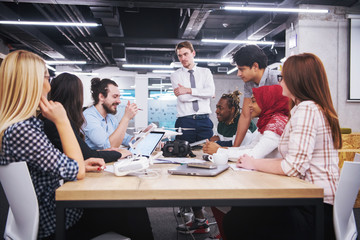 multiethnic business team learning about drone technology