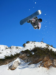 Snowboarding Snowboard Snowboarder at jump mountains at sunny day