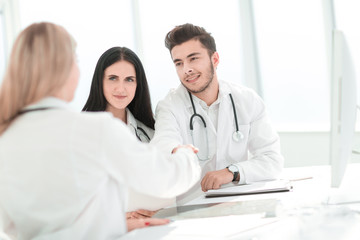 Fototapeta premium handshake of medical doctors at the Desk .