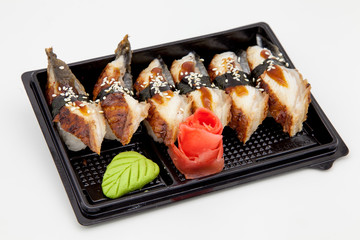 Japanese traditional cuisine, ready-made rolls and sushi in the package, on a white background, for the application and design of fast-food