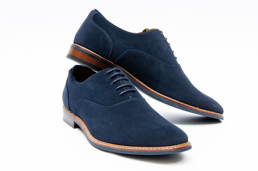 Blue suede shoes isolated on white background