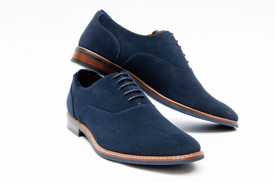 Blue suede shoes isolated on white background