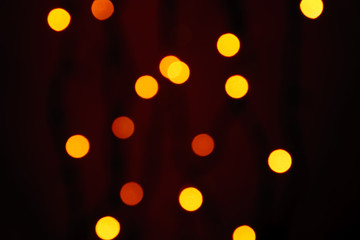 abstract blurred lights on background in red and orange colors. - christmas celebration concept