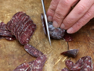 Lukanka is a Bulgarian salami unique to Bulgarian cuisine. Lukanka is semi-dried, has a flattened cylindrical shape, and brownish-red interior in a skin that is normally covered with a white fungus
