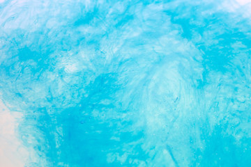 paint in water surface, sky blue abstract background