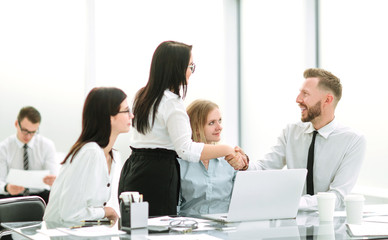 handshake of business people in the workplace in the office