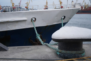 Boat ropes, ship. Mooring post on the waterfront , element for mooring ships in the harbor, safety