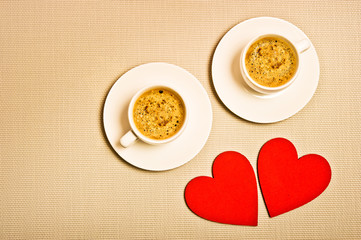 two cups of espresso or moka coffee with red hearts like a cocept for I love coffee