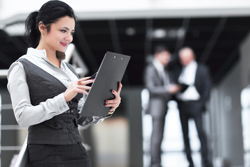 young business woman reading a working paper.