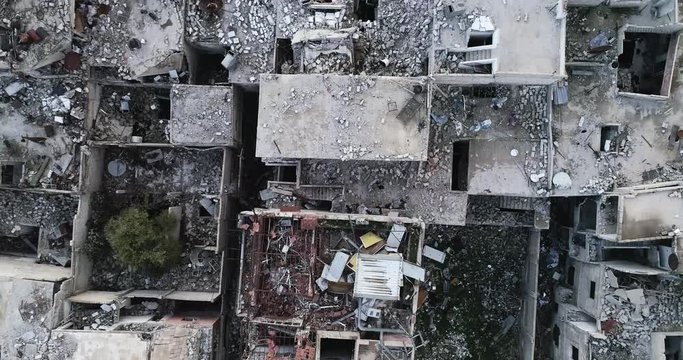 Overhead shot of destroyed buildings and houses  in the middle east after war.