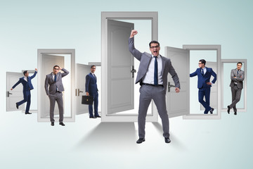 Businessman in uncertainty concept with many doors