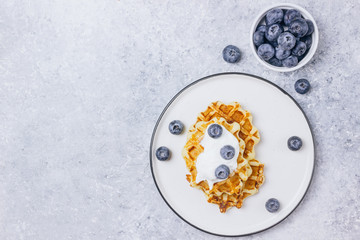 Fresh homemade waffles with blueberries for breakfast