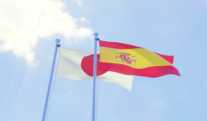 Japan and Spain, two flags waving against blue sky. 3d image