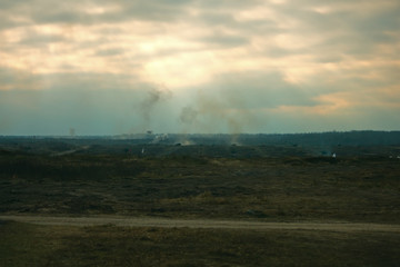 Obraz premium Hostilities. War concept. Military training ground with the explosions.