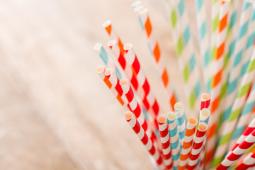 Eco friendly stripped paper straws in a glass, closeup