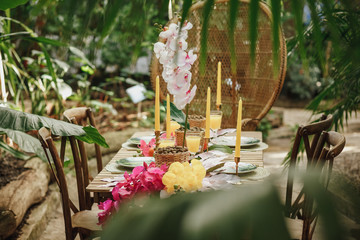 Table setting for a wedding party in a tropical garden