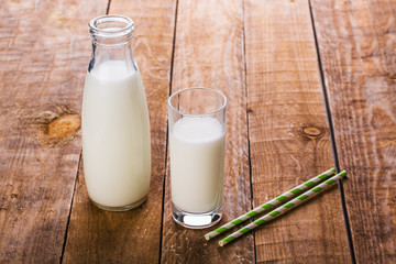 Glass and Bottle of fresh milk and straws