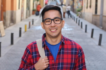 Asian man looking confident outdoors 