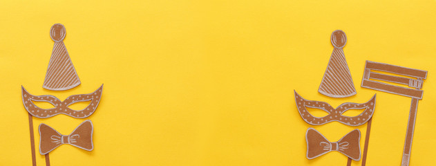 Purim celebration concept (jewish carnival holiday). Traditional symbols shapes cutted from paper. Banner