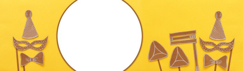 Purim celebration concept (jewish carnival holiday). Traditional symbols shapes cutted from paper
