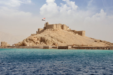 Egypt, Taba, 14-08-2018 years, Saladin castle, view from the sea, a fortress with towers and flag