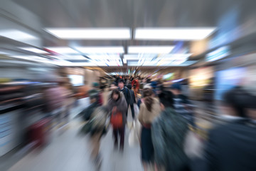 Zoom Motion blur crowd of Japanese passenger in underground / subway transportation, Japan