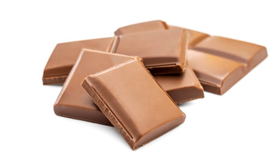 Pieces of chocolate bar on white.