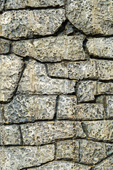 Cladding plates on a wall imitating stone