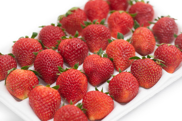 Premium Strawberry in polystyrene foam tray isolate on white background